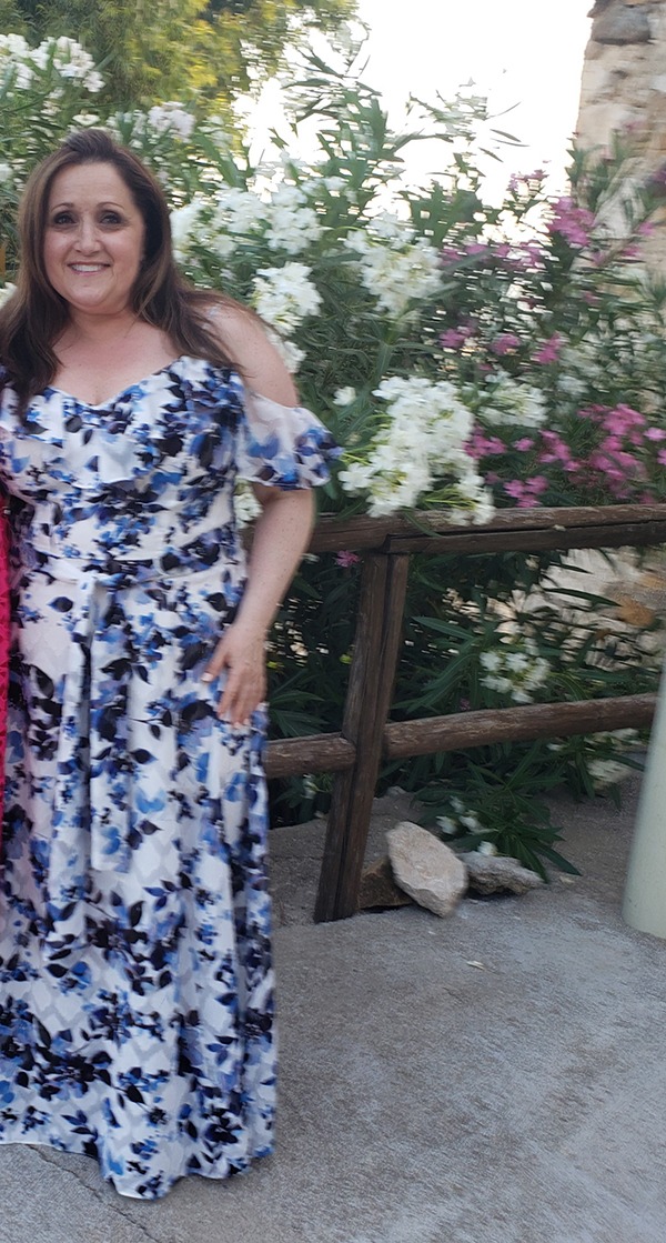 Women in Beautiful Dresses Pose for a Picture